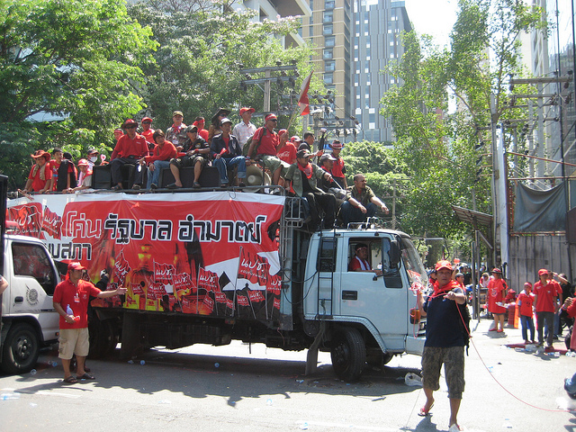 Thai protesters drive into the city