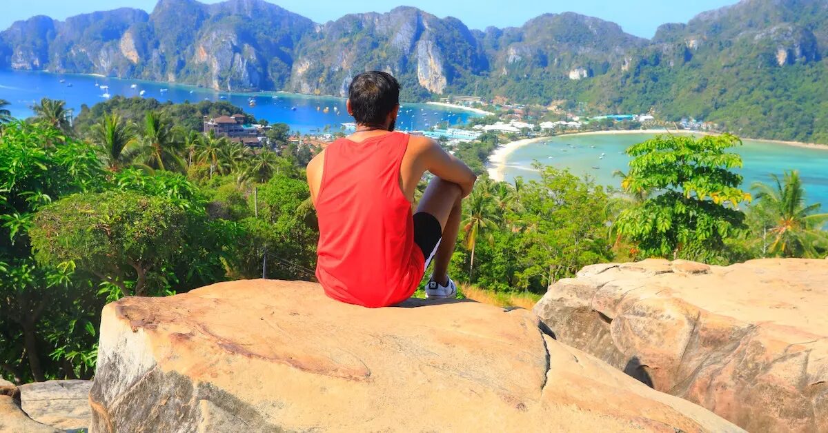 thailand-guy-on-rock-over-beach